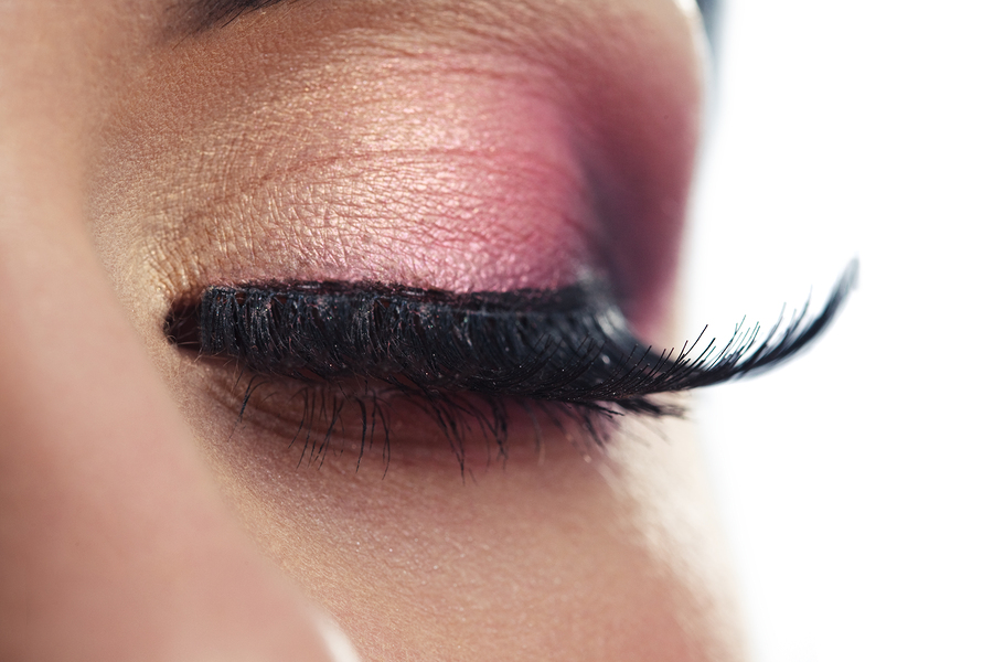 Closeup of a female eye with long false eyelashes