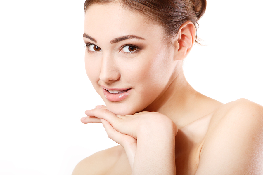 portrait of young beautiful woman smiling and hoolding hand near